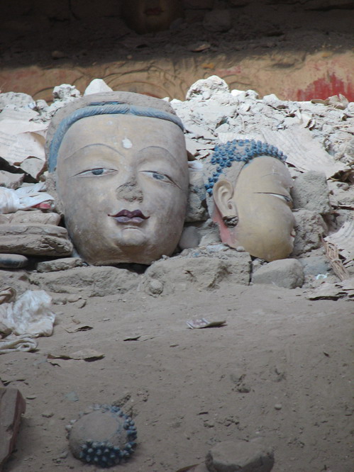 The broken heads from Buddha statues. Toling, Tibet.